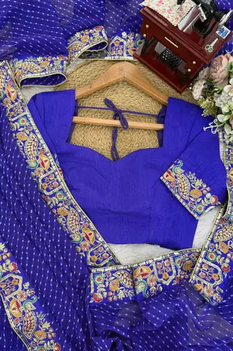Royal blue thread & sequins embroidered faux georgette bandhani print saree with unstitched blouse