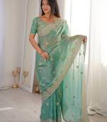 Sea green embroidered organza saree with zari border & unstitched blouse