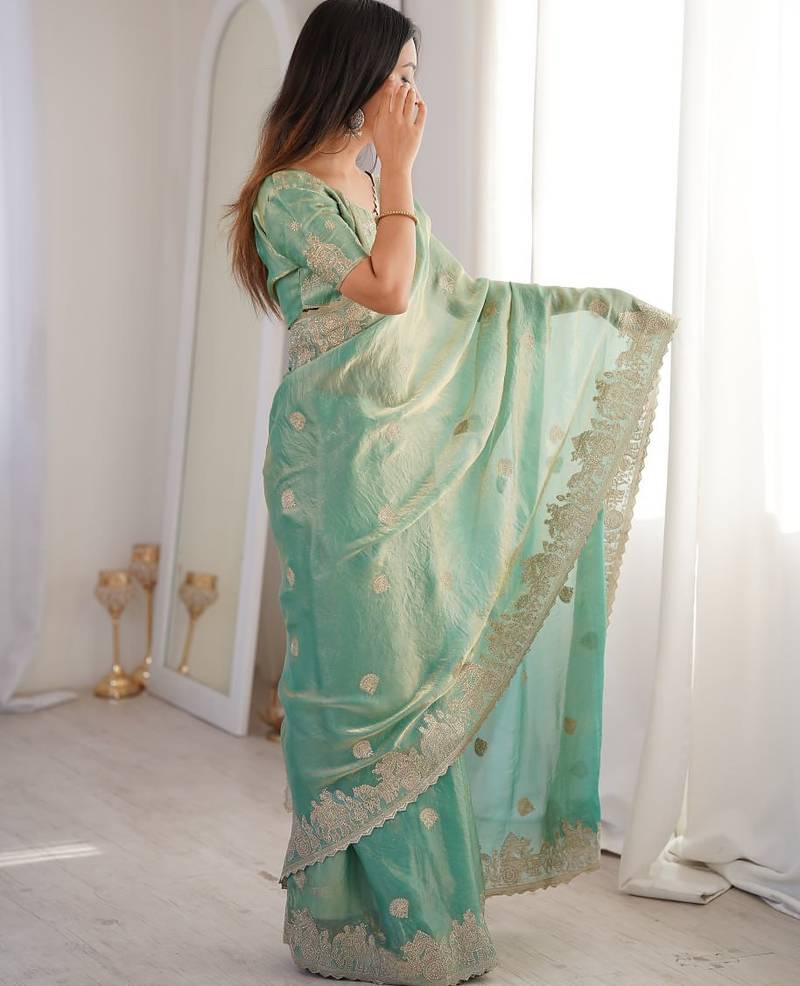Sea green embroidered organza saree with zari border & unstitched blouse