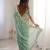 Sea green embroidered organza saree with zari border & unstitched blouse