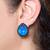 Blue stone metallic stud earrings