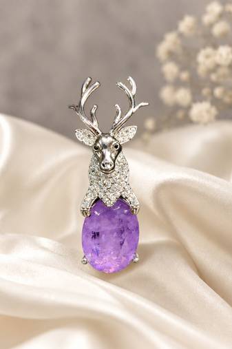 Silver-toned deer brooch pin with purple oval crystal stone
