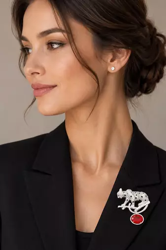 Silver rhodium plated leopard brooch with red crystal drop 