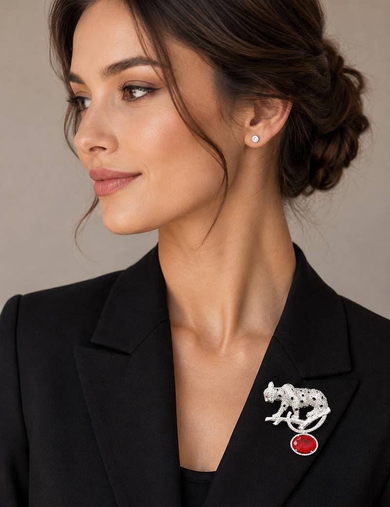 Silver rhodium plated leopard brooch with red crystal drop 