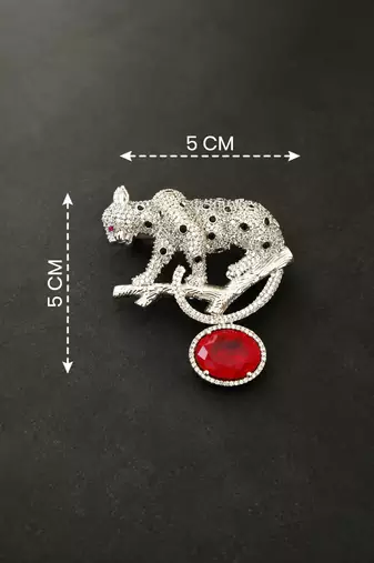 Silver rhodium plated leopard brooch with red crystal drop 