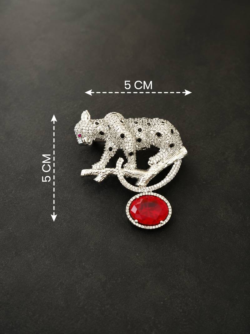 Silver rhodium plated leopard brooch with red crystal drop 