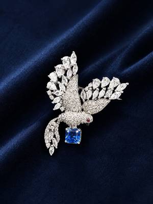 Silver rhodium plated flying bird brooch with blue crystal  1