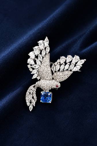 Silver rhodium plated flying bird brooch with blue crystal 