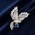 Silver rhodium plated flying bird brooch with blue crystal 