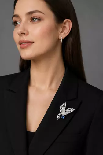 Silver rhodium plated flying bird brooch with blue crystal 