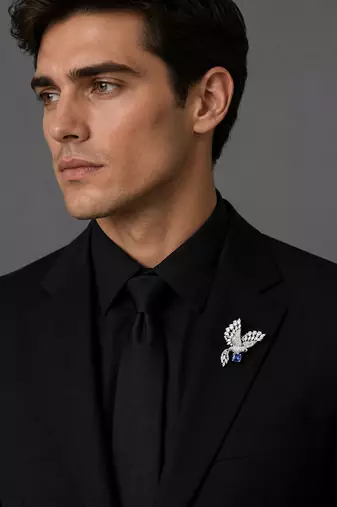 Silver rhodium plated flying bird brooch with blue crystal 