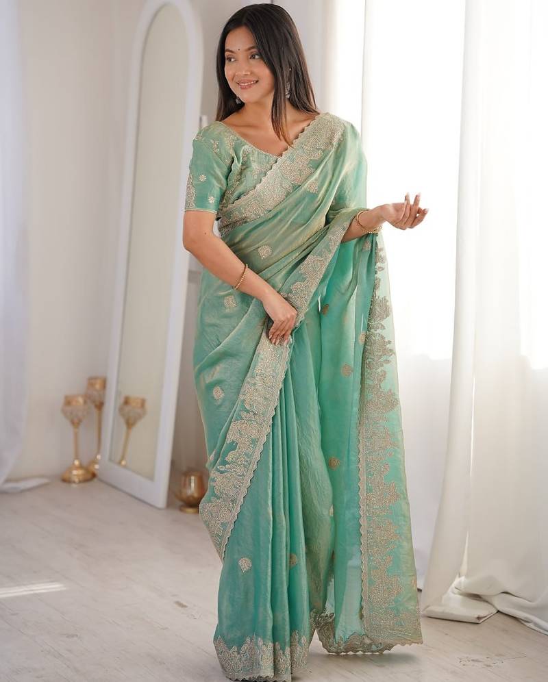 Vibrant firozy festival saree with traditional silver zari embroidery and blouse material