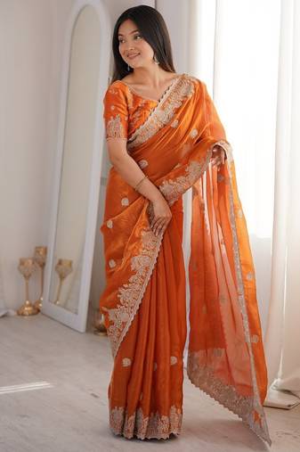 Vibrant rust orange festival saree with traditional silver zari embroidery and blouse material