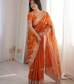 Vibrant rust orange festival saree with traditional silver zari embroidery and blouse material