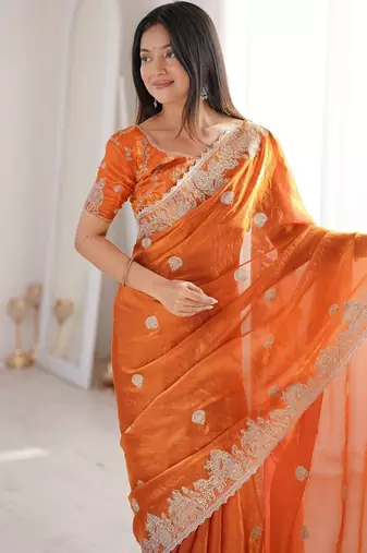 Vibrant rust orange festival saree with traditional silver zari embroidery and blouse material