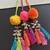 Handmade multicolored boho pompom parandi