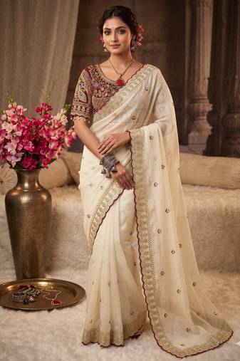 Cream embroidered rangoli silk saree with sequins work and stitched bangalori silk blouse