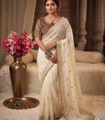 Cream embroidered rangoli silk saree with sequins work and stitched bangalori silk blouse