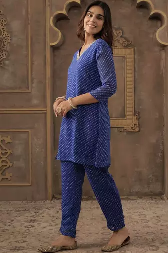 Women Ethnic Motifs Printed Thread Work Kurta with Trousers