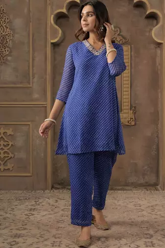 Women Ethnic Motifs Printed Thread Work Kurta with Trousers
