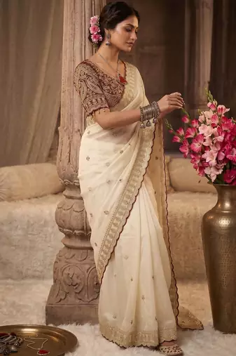 Cream embroidered rangoli silk saree with sequins work and stitched bangalori silk blouse