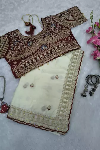 Cream embroidered rangoli silk saree with sequins work and stitched bangalori silk blouse