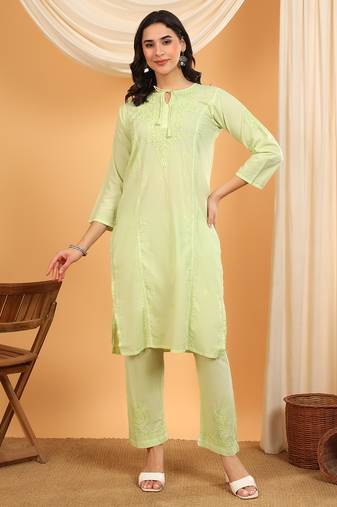 Women green ethnic motifs embroidered chikankari cotton tie up neck kurta palazzo set