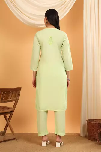 Women green ethnic motifs embroidered chikankari cotton tie up neck kurta palazzo set