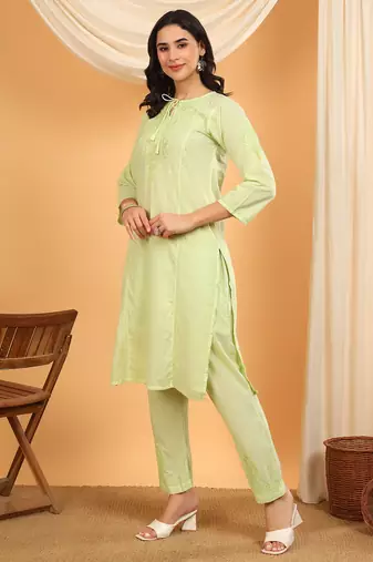 Women green ethnic motifs embroidered chikankari cotton tie up neck kurta palazzo set