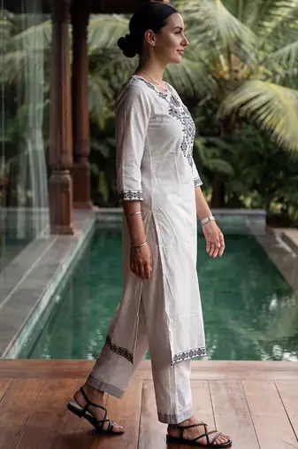 Women Embroidered Thread Work Cotton Kurta with Trousers