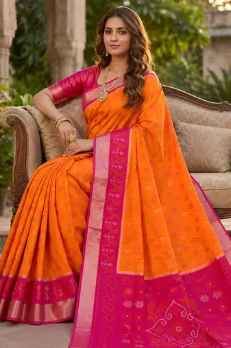 Orange soft silk blend pochampalli saree with zari weaving meenakari design