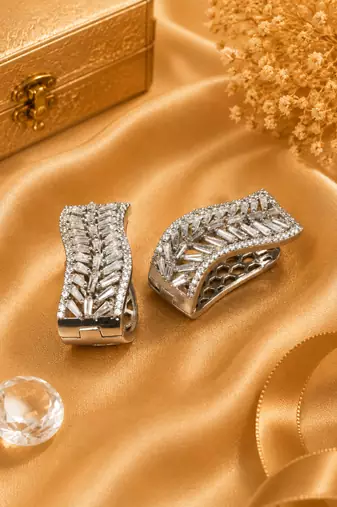 silver color rhodium finish elegant curved american diamond hoop earrings