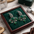 Traditional antique silver finish statement chandelier earrings with green onyx and pearl accents for women