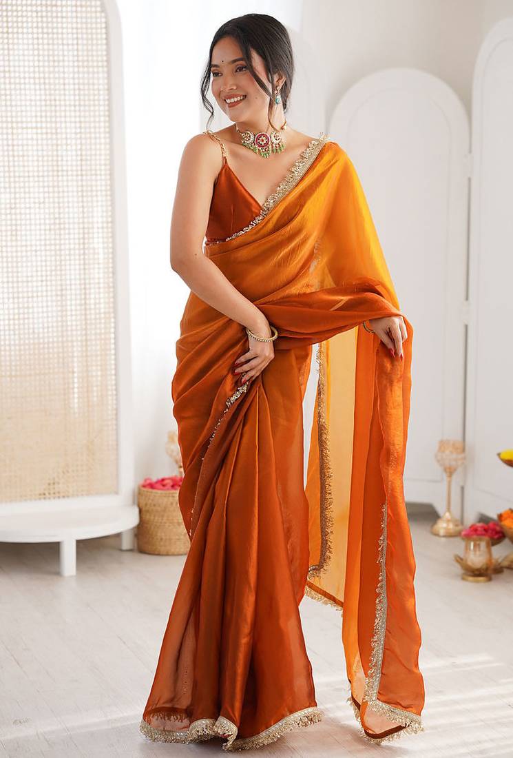 Orange fendy satin shaded with lace border saree with blouse