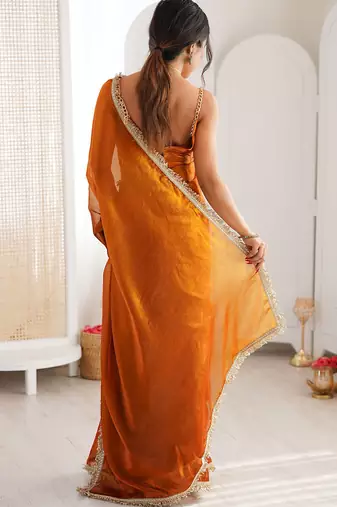 Orange fendy satin shaded with lace border saree with blouse