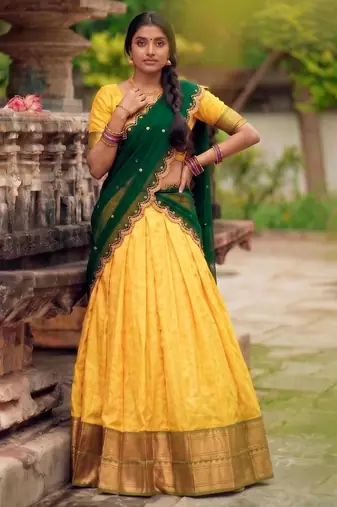 yellow cotton silk woven traditional lehenga choli with free size upto 42