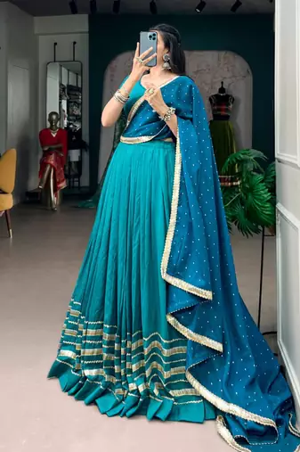 teal silk blend embroidered traditional lehenga choli with free size upto 42