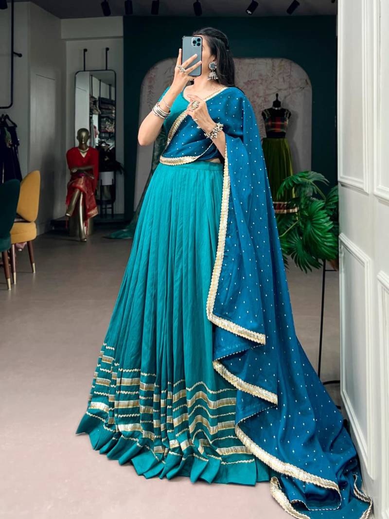 teal silk blend embroidered traditional lehenga choli with free size upto 42