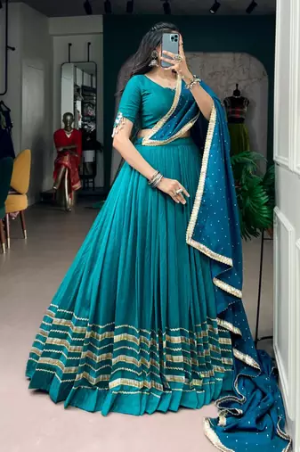 teal silk blend embroidered traditional lehenga choli with free size upto 42