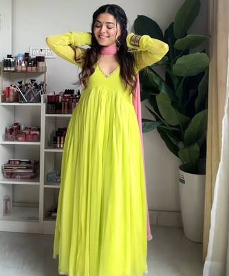 Green faux georgette embroidered flared gown set 1