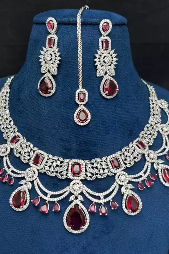 ruby red bridal jewellery set, silver-plated choker, drop earrings, maang tikka, bollywood statement necklace