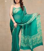 teal green abstrect print chiffon saree with unstitched blouse piece
