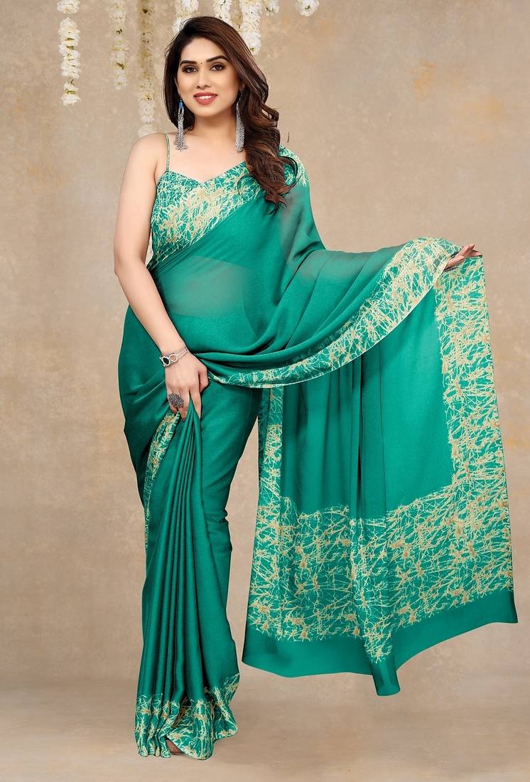 teal green abstrect print chiffon saree with unstitched blouse piece
