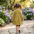 Girls printed cotton linen a-line dress – sleeveless olive gold summer frock with dual front bows