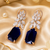 Rose gold finish regal petal drop earrings
