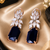 Rose gold finish regal petal drop earrings