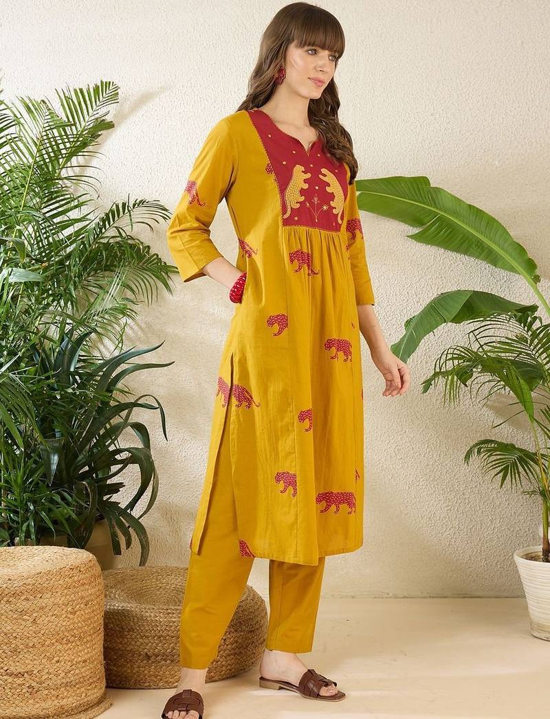 Women Animal Printed Tiered Thread Work Cotton Kurta with Trousers