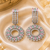 Rhodium finish pastel cz halo dangle earrings