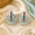 Rhodium finish frosted blossom earrings
