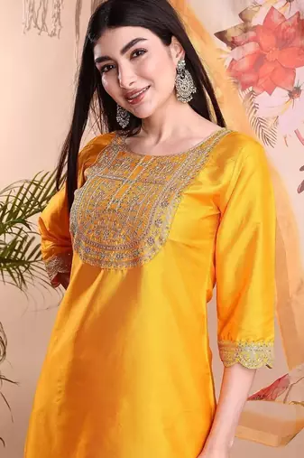 Mustard color art silk embroidered yoke design kurti pant dupatta set.